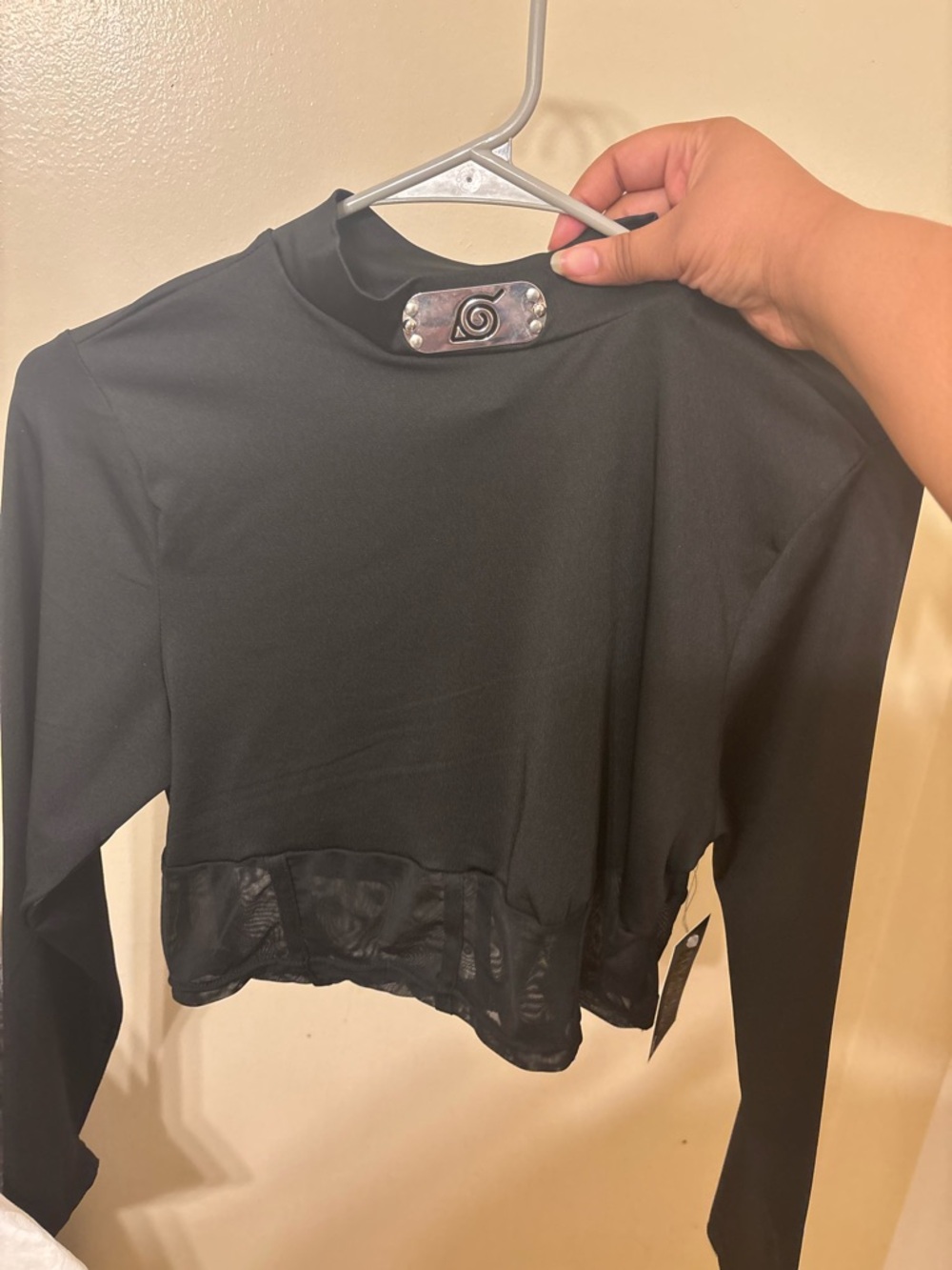Spencer's Black Long-Sleeve Mock Neck Crop Top with Mesh Hem Accent